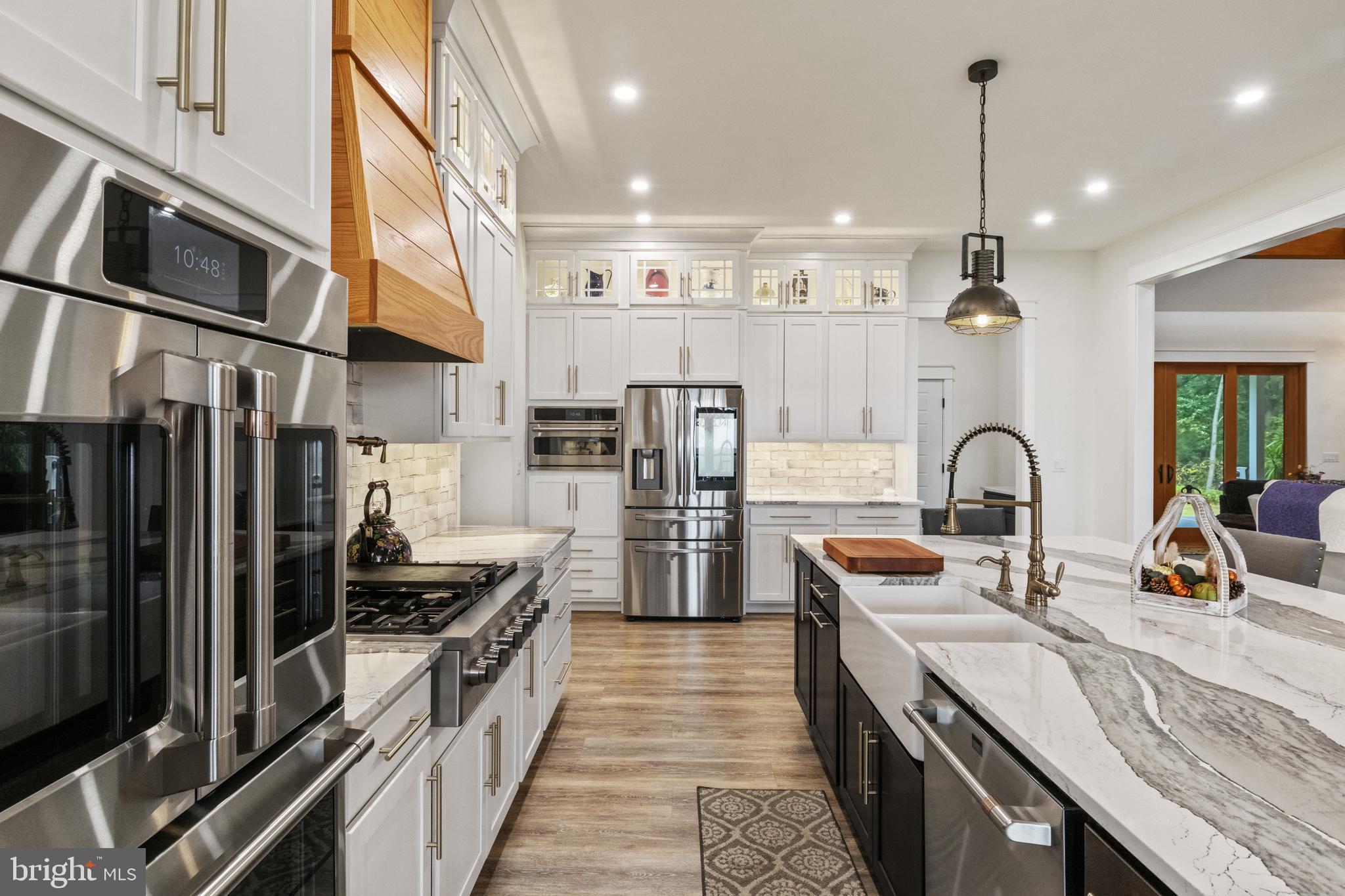 4073 Landis Road Hanover, PA 17331 - Photo 21 of 100 a kitchen with stainless steel appliances granite countertop a sink and a refrigerator