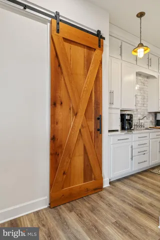 a bedroom with a bed and a flat tv screen