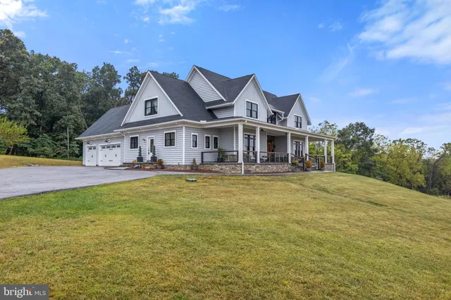 a living room with furniture fireplace and flat screen tv
