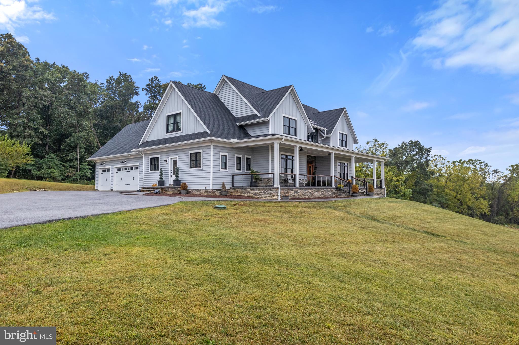 4073 Landis Road Hanover, PA 17331 - Photo 3 of 100 a front view of a house with a garden and swimming pool