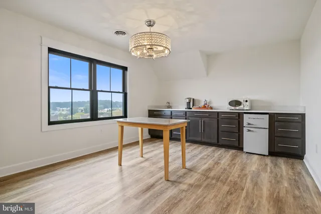 an aerial view of house with yard swimming pool and outdoor seating