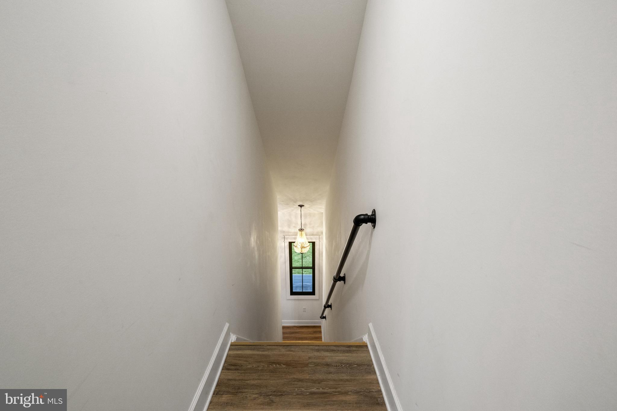 4073 Landis Road Hanover, PA 17331 - Photo 58 of 100 a view of a hallway with wooden floor and staircase