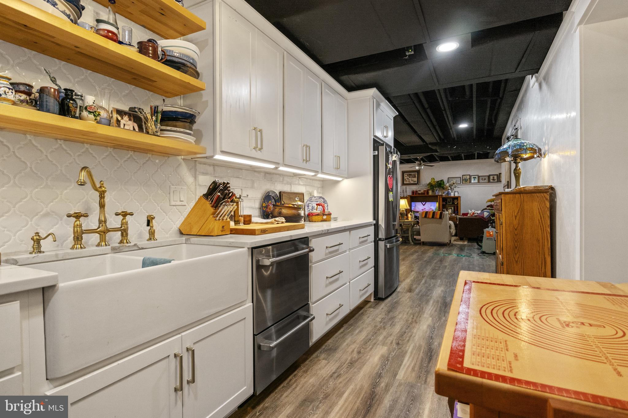4073 Landis Road Hanover, PA 17331 - Photo 62 of 100 a kitchen with stainless steel appliances granite countertop a lot of cabinets and wooden floor