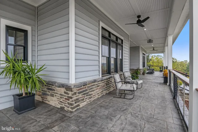 a kitchen with stainless steel appliances granite countertop a sink and a refrigerator