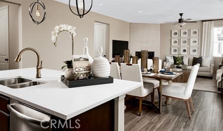 187 Knotgrass Street Hemet, CA 92543 - Photo 2 of 6 a kitchen with a table chairs and a dining table