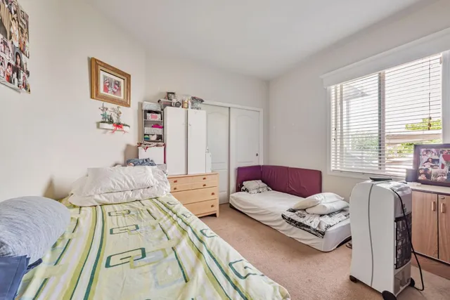a bedroom with a bed and a cabinets