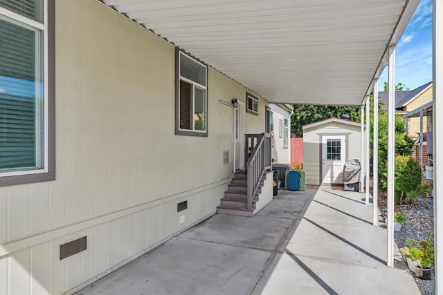 a view of a chair and table in the patio