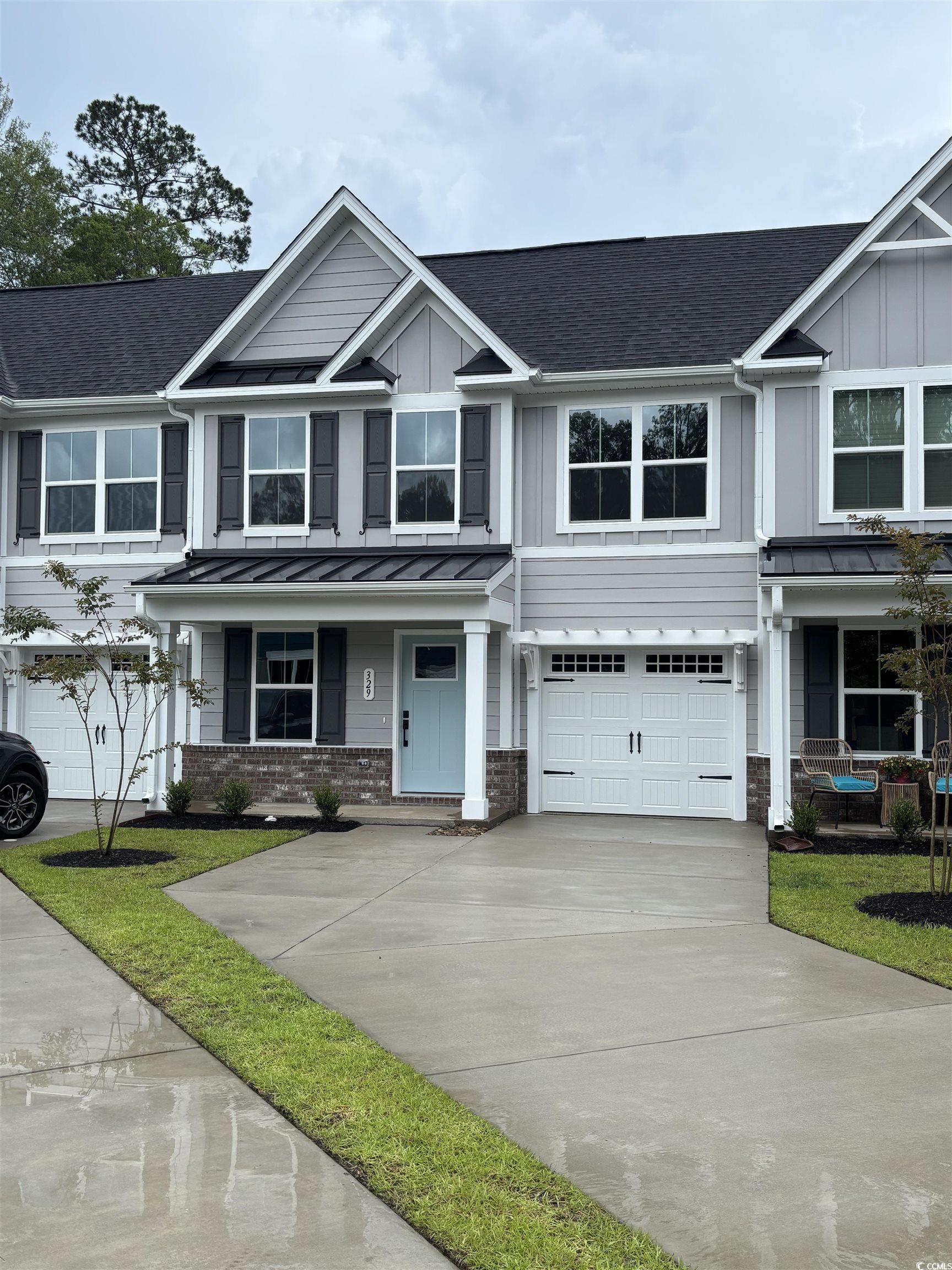 329 Bent Green, Unit 90E Murrells Inlet, SC 29576 - Photo 1 of 14 View of front of property with a standing seam roo