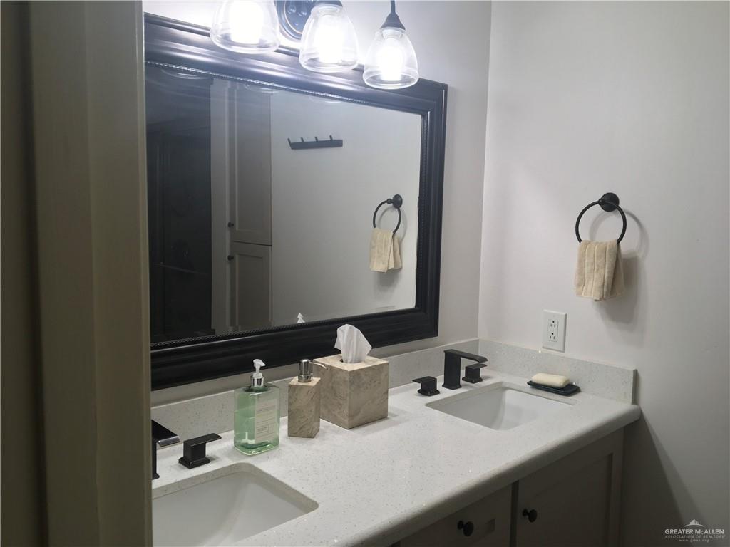 700 Fern Street, Unit 5 McAllen, TX 78504 - Photo 15 of 22 a bathroom with a sink and a mirror