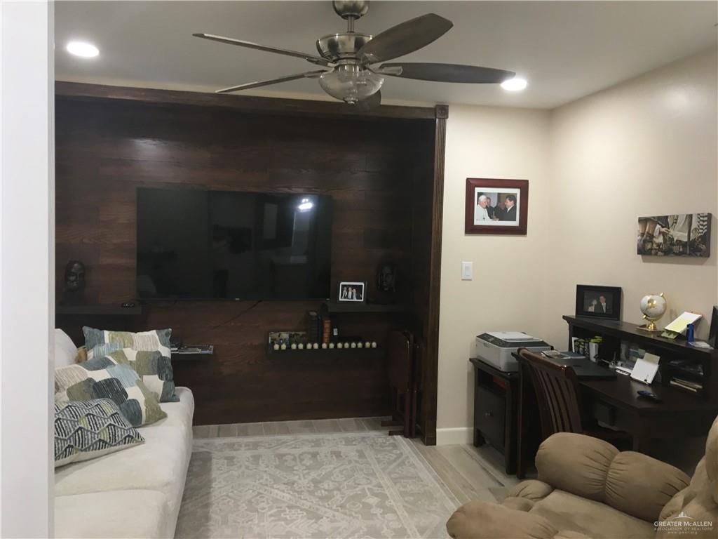 700 Fern Street, Unit 5 McAllen, TX 78504 - Photo 5 of 22 a living room with furniture and a flat screen tv
