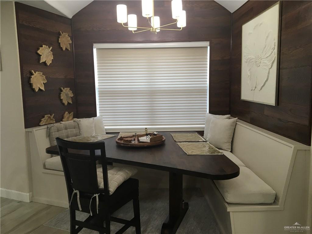 700 Fern Street, Unit 5 McAllen, TX 78504 - Photo 7 of 22 a view of a dining room with furniture and window