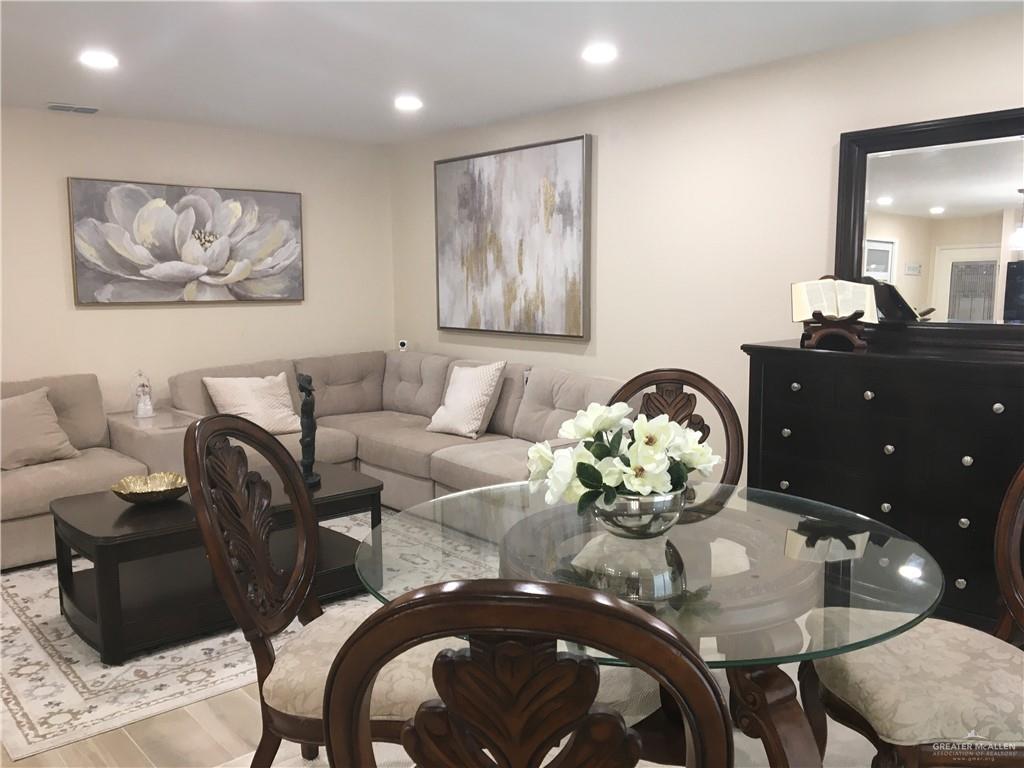 700 Fern Street, Unit 5 McAllen, TX 78504 - Photo 8 of 22 a dining room with furniture and wooden floor