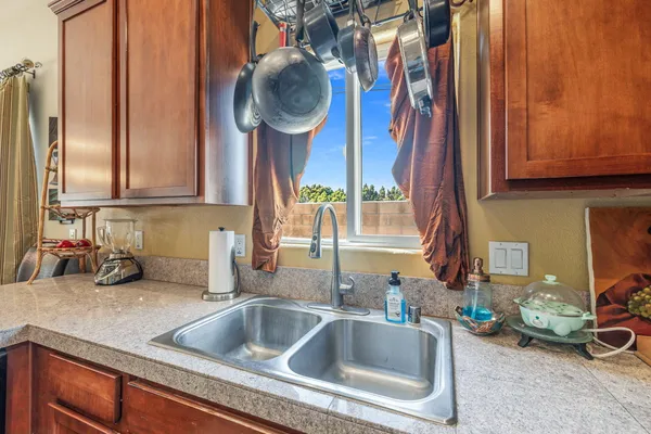 a kitchen with stainless steel appliances granite countertop a stove and a microwave