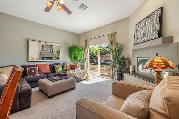 a living room with furniture and a large window