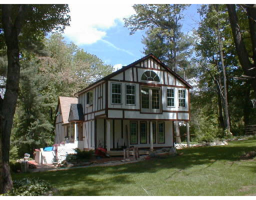 497 Clark Road Holland, MA 01521 - Photo 1 of 1 a view of a house with yard and plants