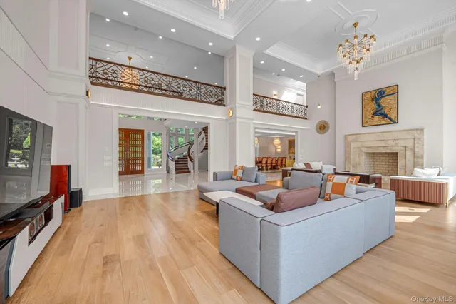 a living room with fireplace furniture and a flat screen tv