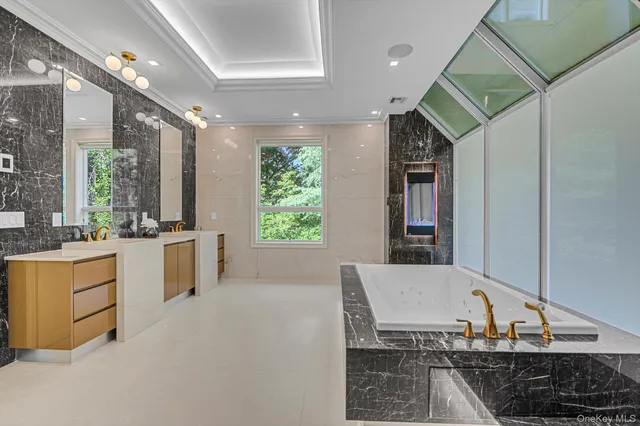 a large space with a large tub and shower