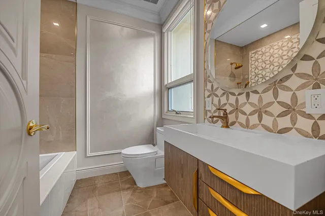 a large bathroom with a tub sink shower and mirror