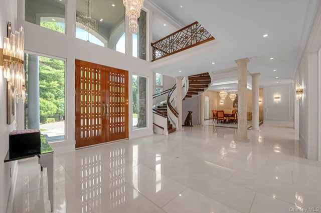 a view of a livingroom with furniture and a floor to ceiling window