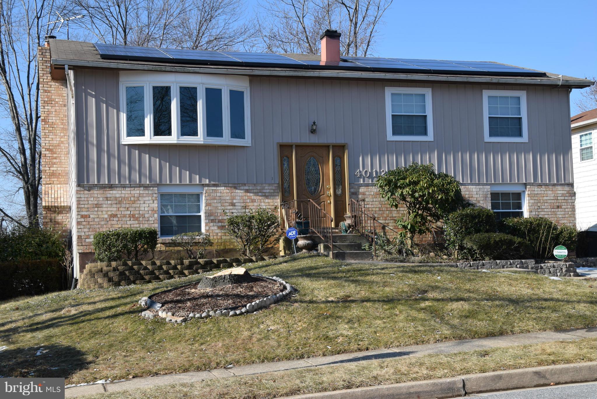 4012 Winlee Road Randallstown, MD 21133 - Photo 1 of 22 a view of a brick house with a yard