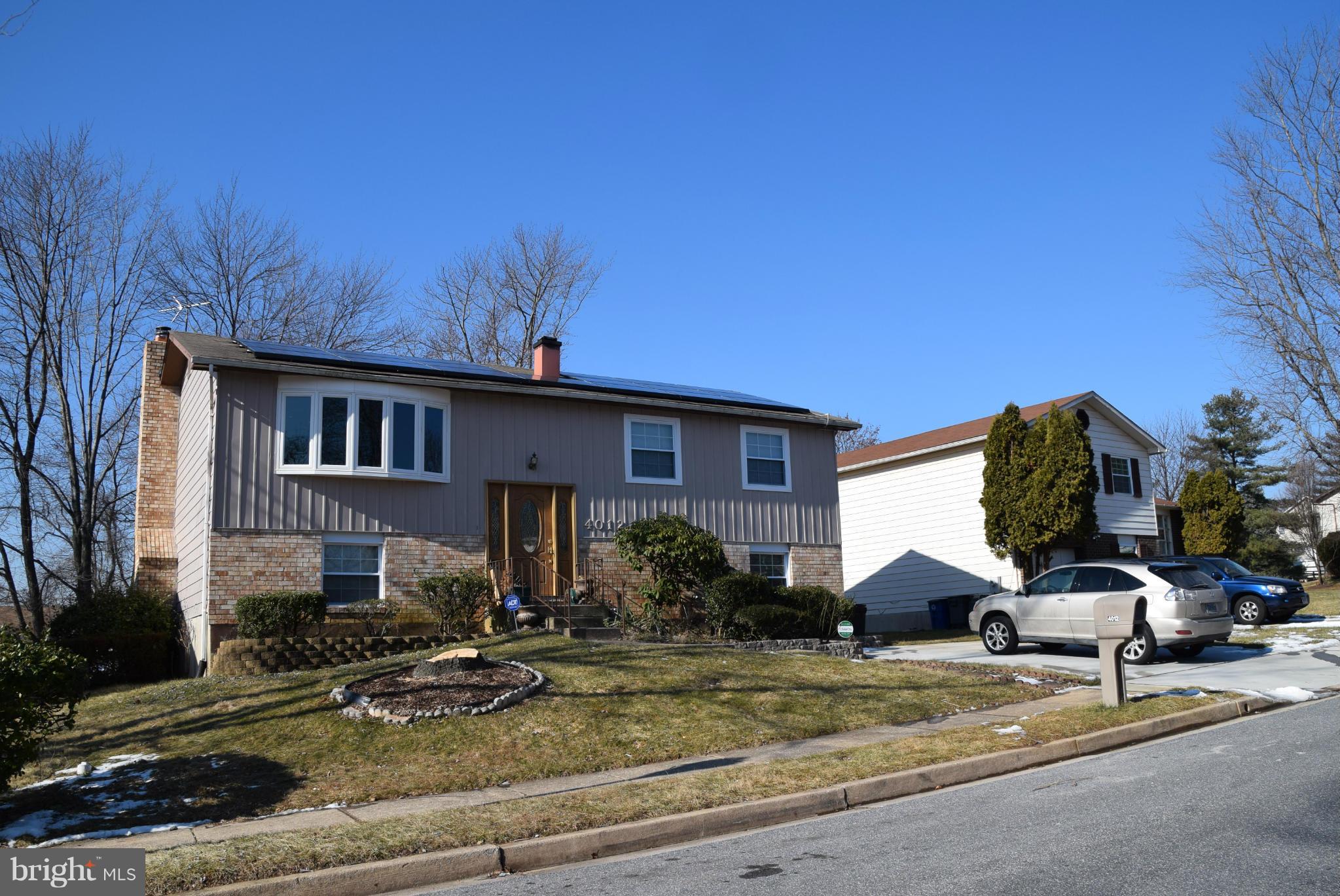 4012 Winlee Road Randallstown, MD 21133 - Photo 14 of 22 a front view of a house with garden
