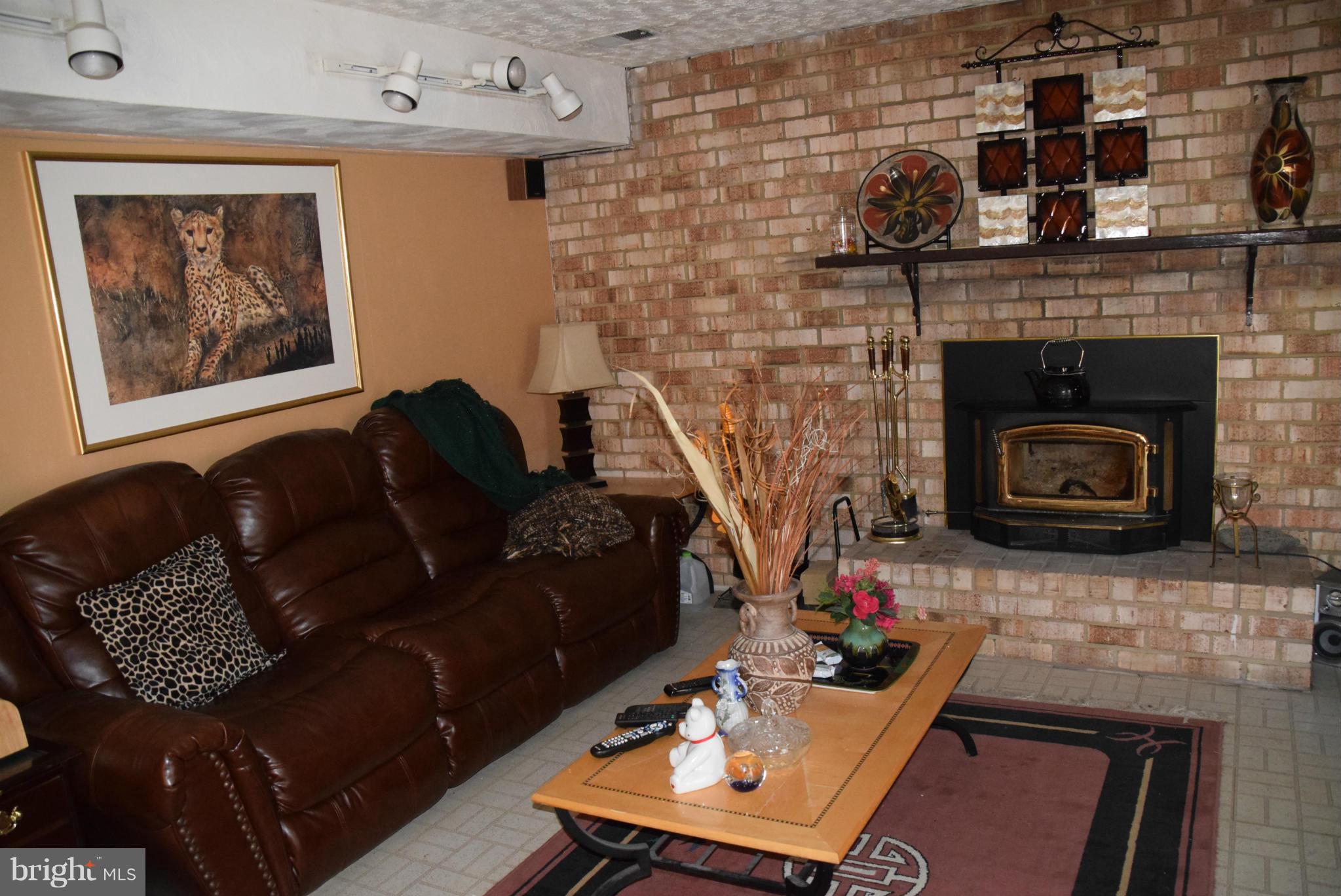 4012 Winlee Road Randallstown, MD 21133 - Photo 15 of 22 a living room with furniture and a fireplace
