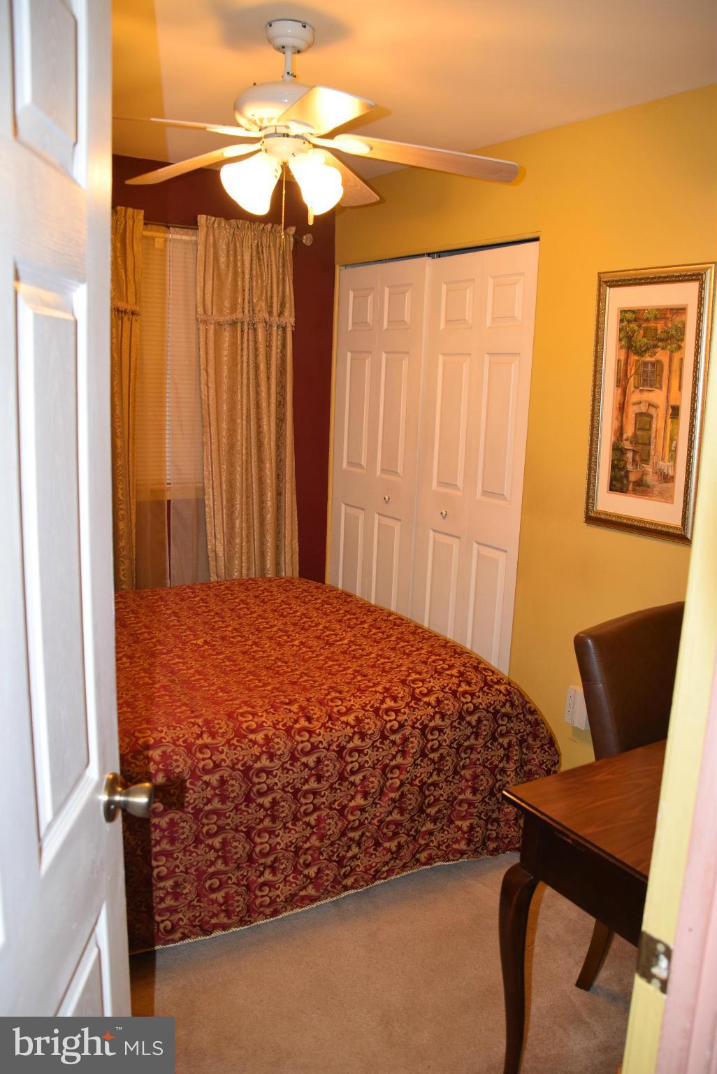 4012 Winlee Road Randallstown, MD 21133 - Photo 6 of 22 a bedroom with a bed and furniture