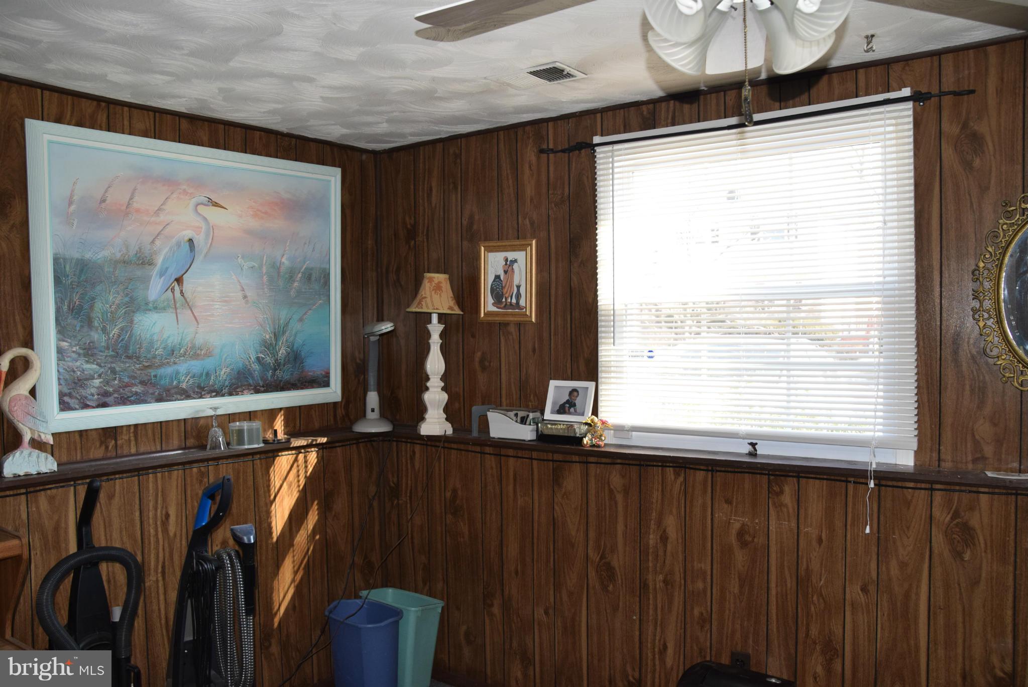4012 Winlee Road Randallstown, MD 21133 - Photo 10 of 22 a view of a room with furniture wooden floor and window