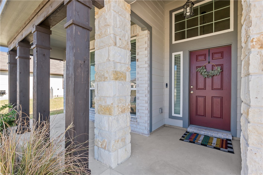 1925 Viva Road Bryan, TX 77807 - Photo 4 of 25 View of exterior entry with covered porch and stone siding