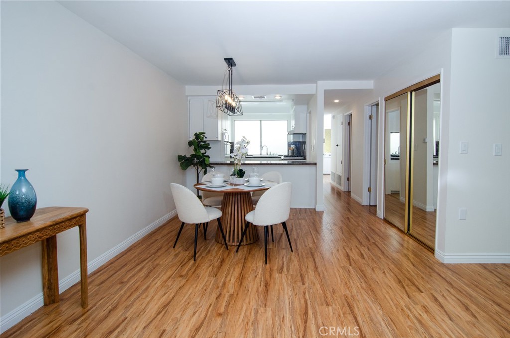26701 Oak Branch Circle Newhall, CA 91321 - Photo 21 of 44 a view of a dining room with furniture and wooden floor
