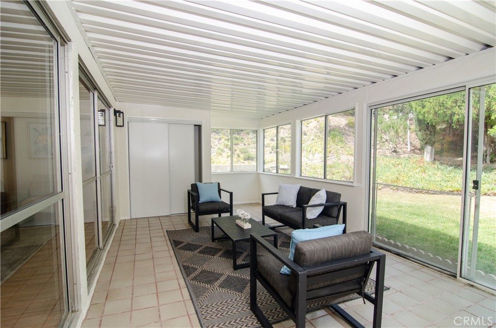 26701 Oak Branch Circle Newhall, CA 91321 - Photo 24 of 44 a living room with furniture and a floor to ceiling window