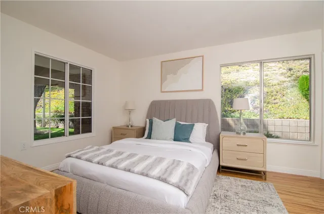 a bedroom with a large bed and a window