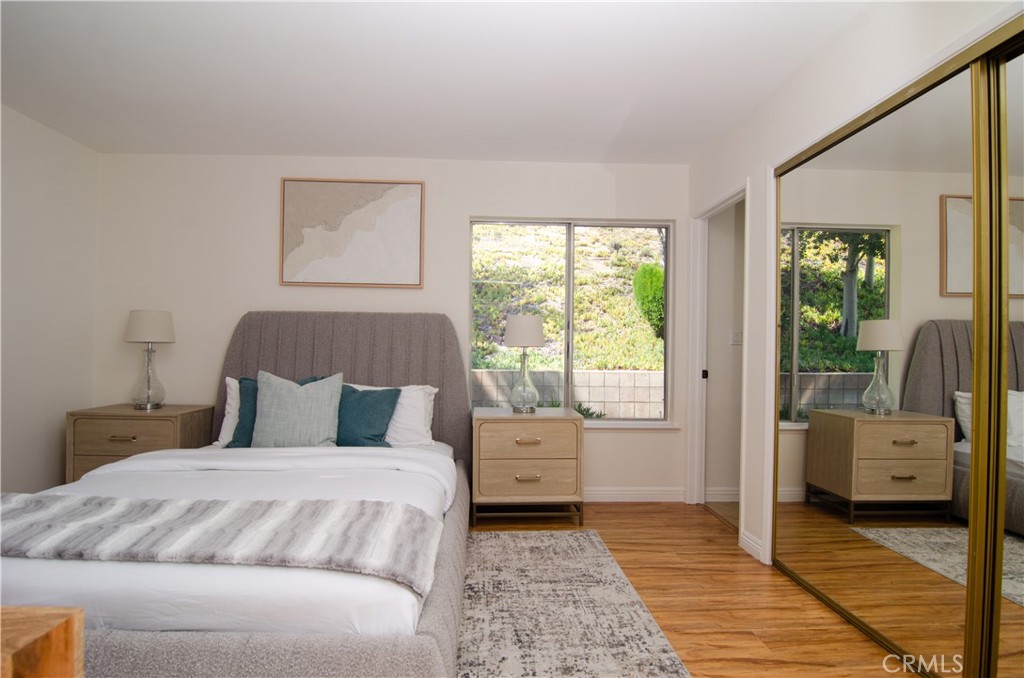 26701 Oak Branch Circle Newhall, CA 91321 - Photo 27 of 44 a bedroom with a large bed and a window