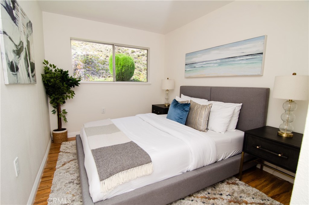 26701 Oak Branch Circle Newhall, CA 91321 - Photo 33 of 44 a bed sitting in a bedroom next to a window