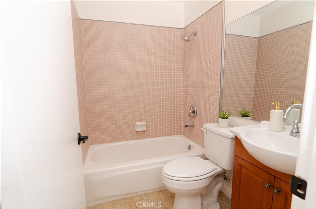 26701 Oak Branch Circle Newhall, CA 91321 - Photo 35 of 44 a bathroom with a sink a toilet and shower