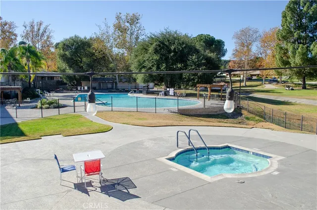 a view of a swimming pool with seating area