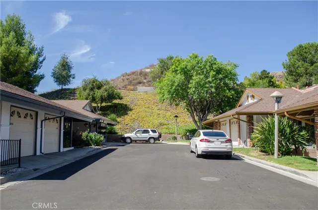a view of a car parked in front of a house
