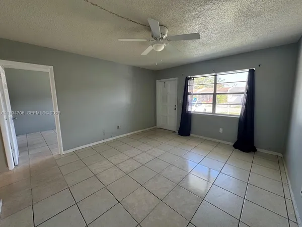 a view of an empty room and window