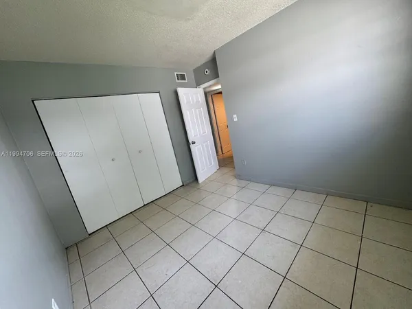 an empty room with cabinet
