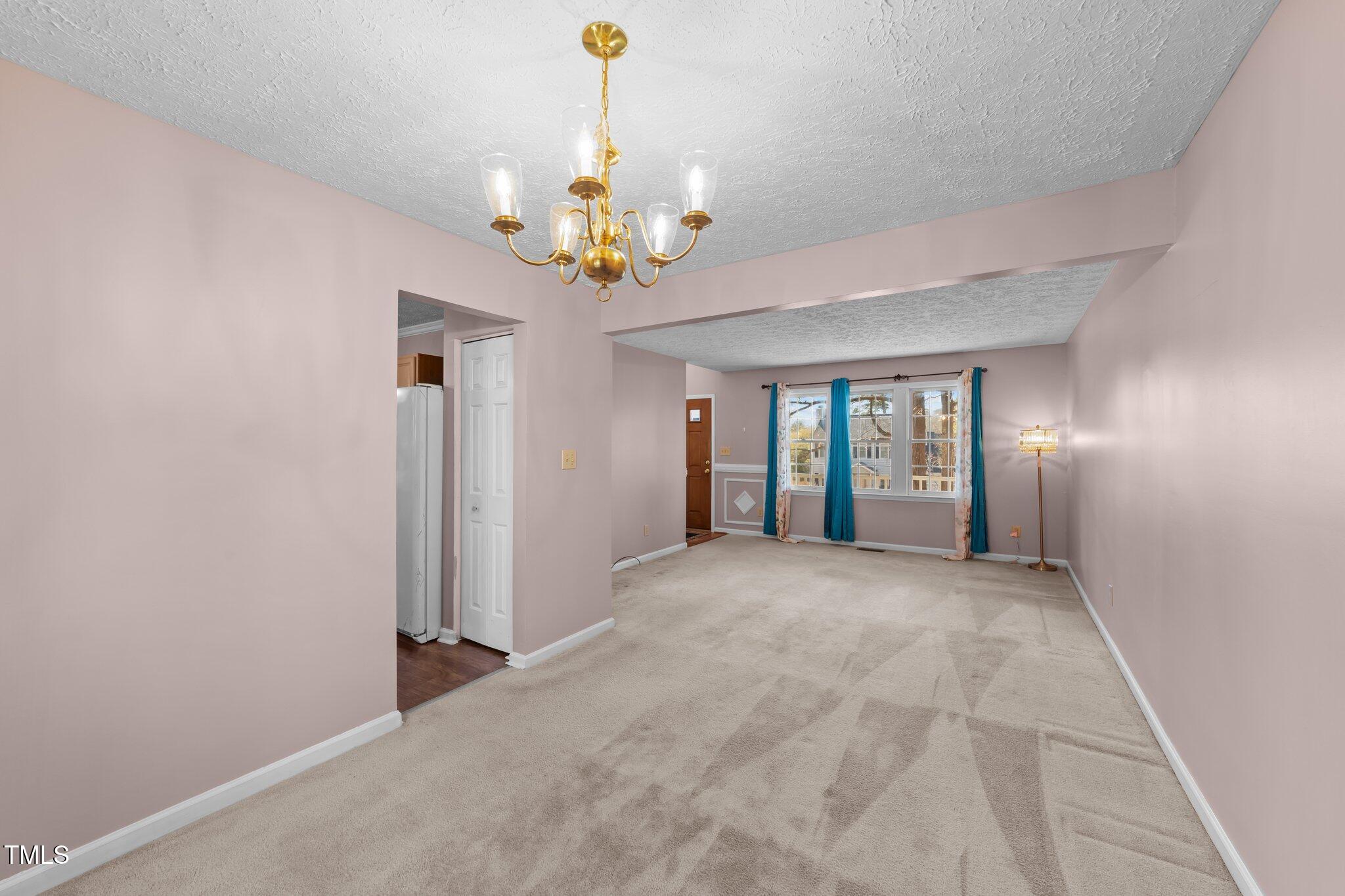 300 Pate Street Apex, NC 27502 - Photo 10 of 38 a view of an empty room with a window