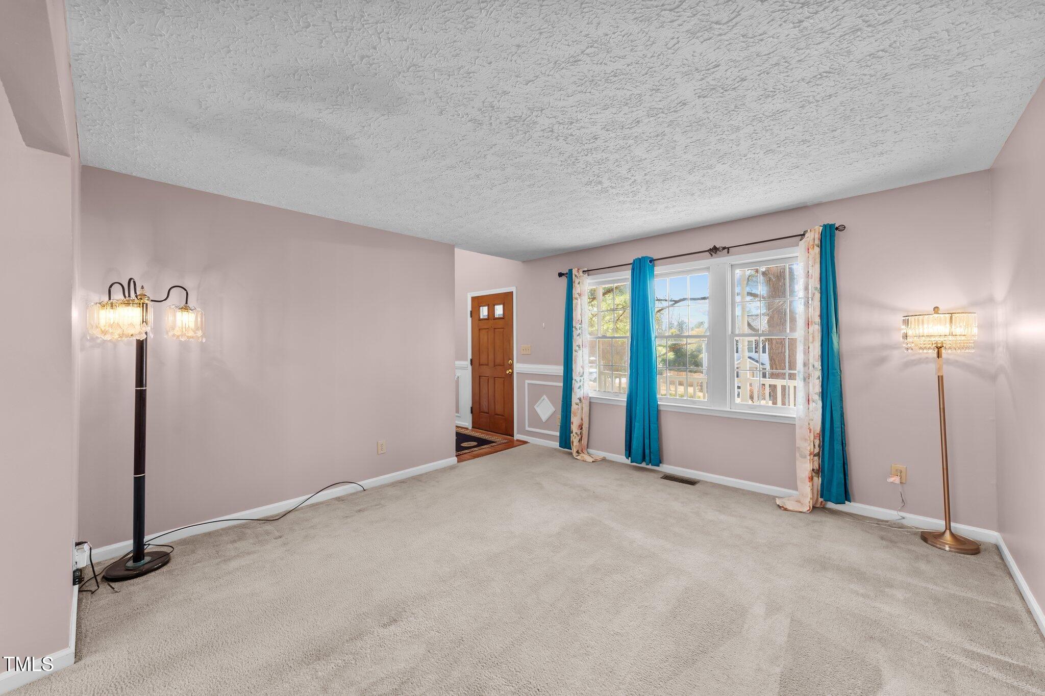 300 Pate Street Apex, NC 27502 - Photo 11 of 38 an empty room with windows