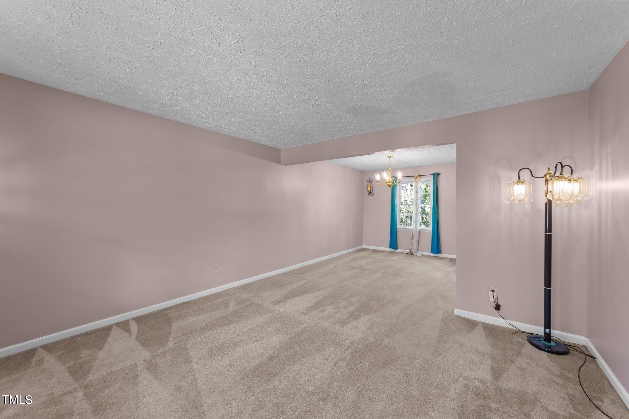 300 Pate Street Apex, NC 27502 - Photo 13 of 38 a view of an empty room with a window