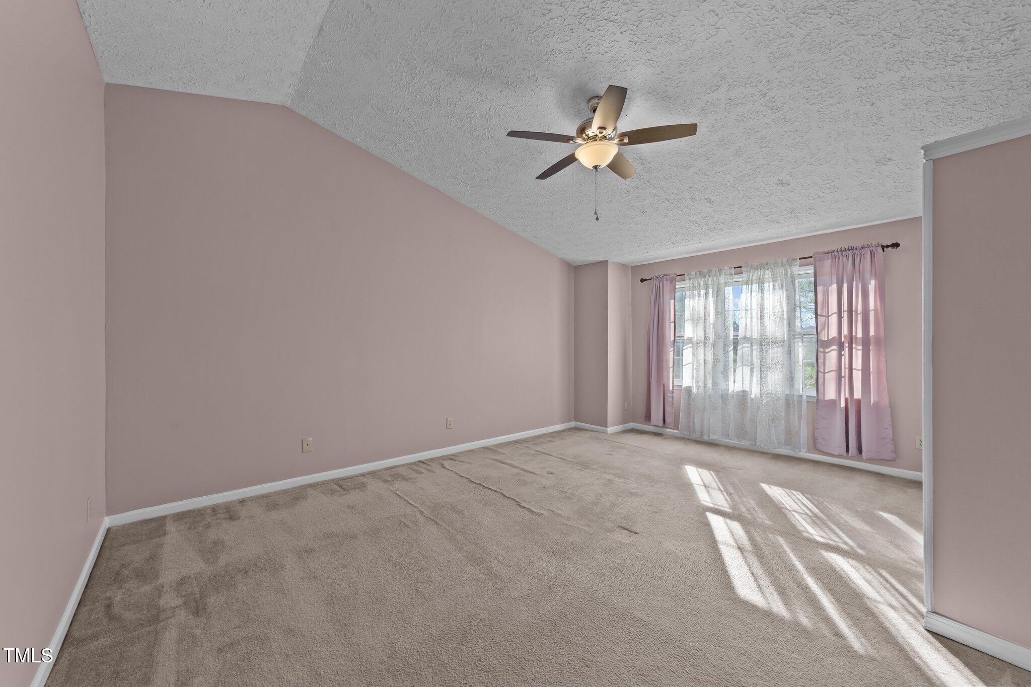 300 Pate Street Apex, NC 27502 - Photo 16 of 38 a view of an empty room with a window