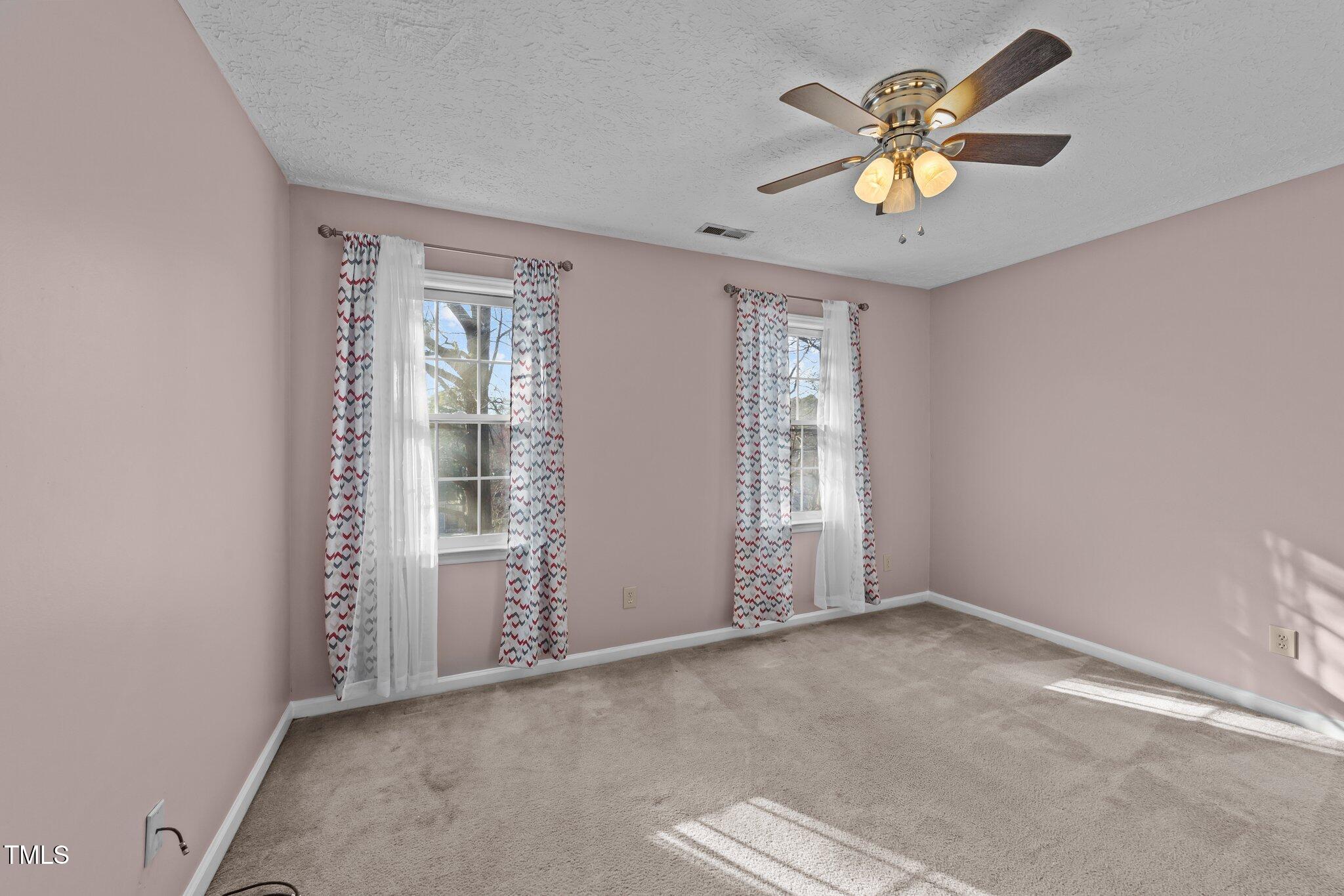 300 Pate Street Apex, NC 27502 - Photo 23 of 38 an empty room with windows