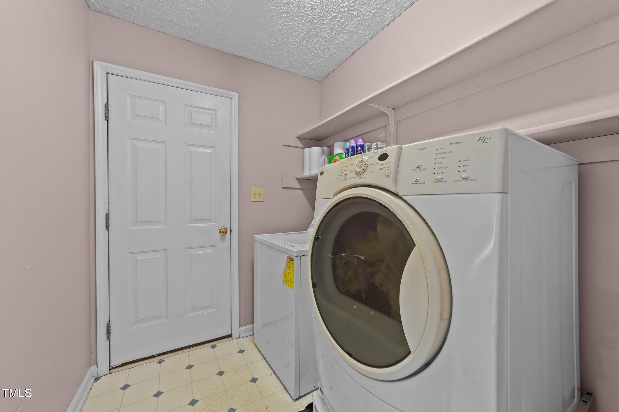 300 Pate Street Apex, NC 27502 - Photo 28 of 38 a utility room with dryer and washer