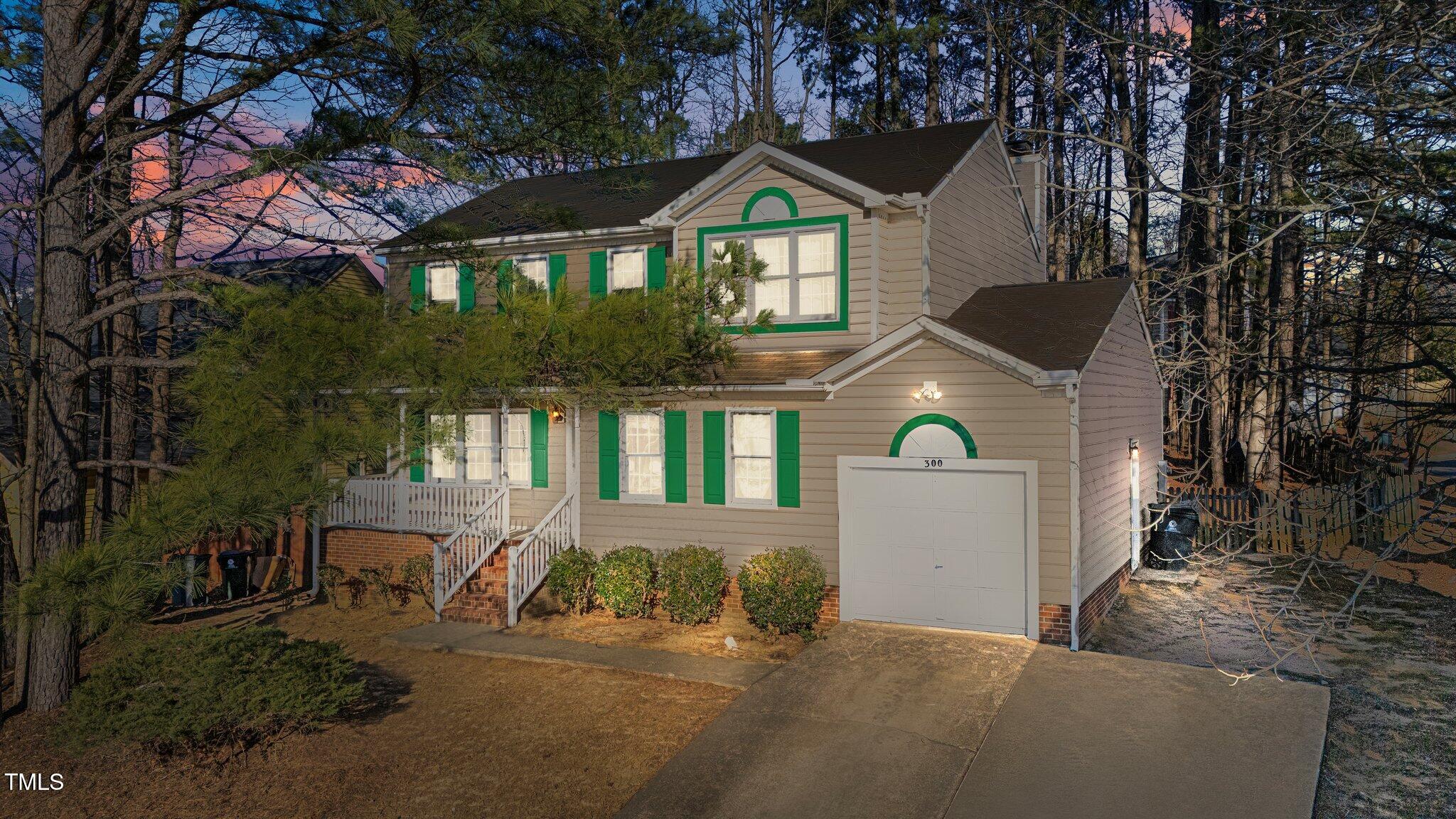 300 Pate Street Apex, NC 27502 - Photo 2 of 38 a front view of a house with a yard