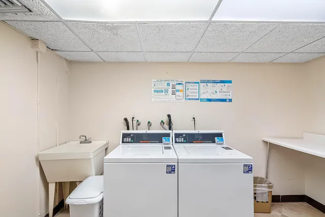 a view of swimming pool with a table and chairs