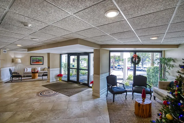 a view of a lake with chairs