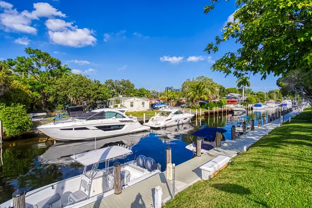 a living room with lots of furniture and a large window