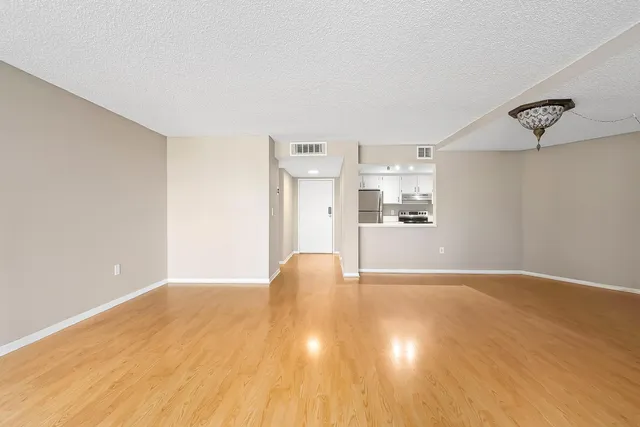 a white stove top oven sitting inside of a kitchen